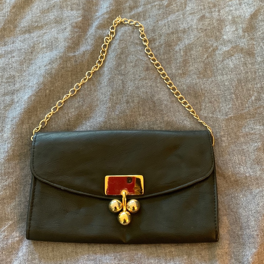 Black clutch with gold hardware